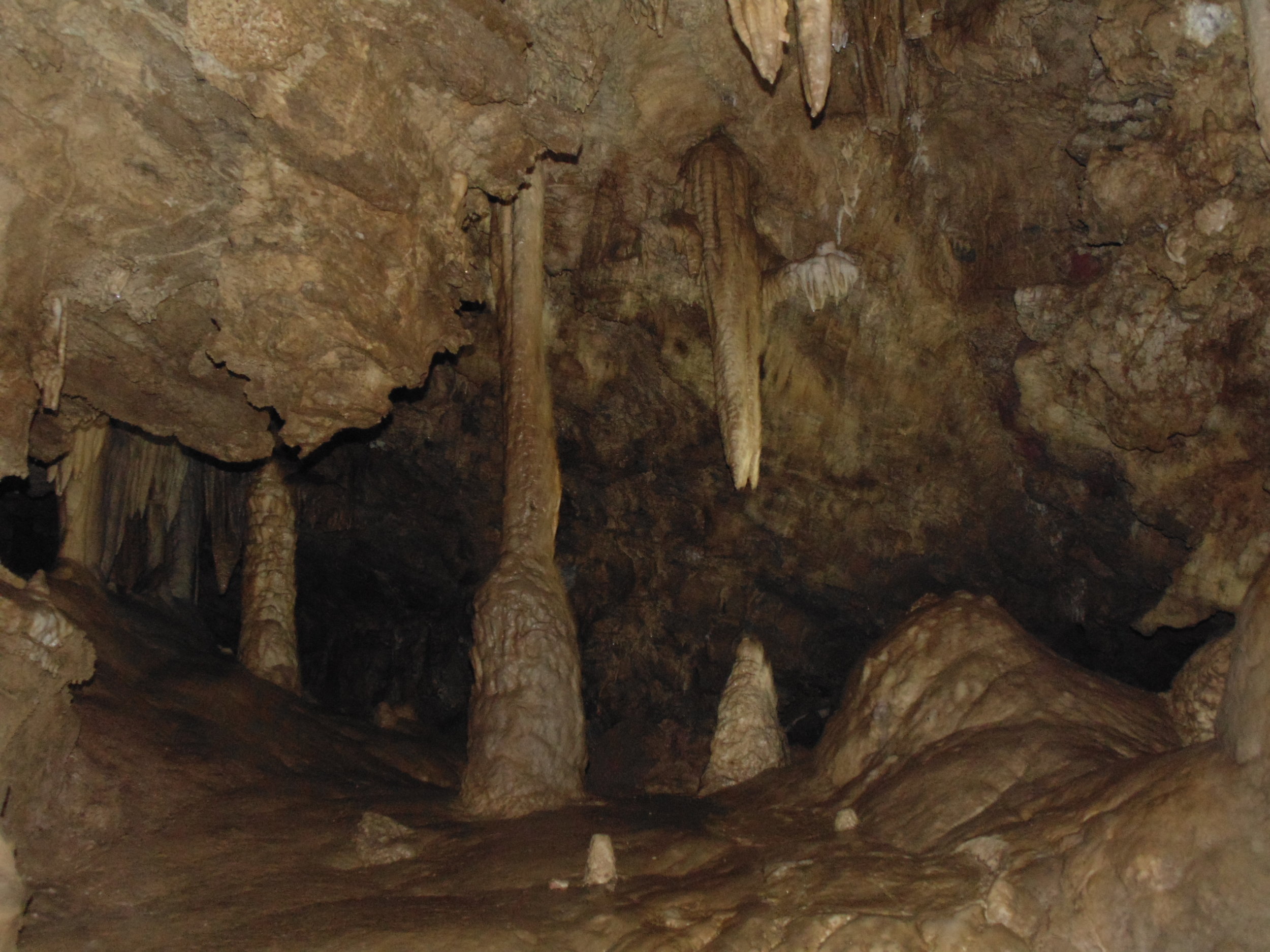 Cave with eerie echoes, representing Timber Creek's haunting.