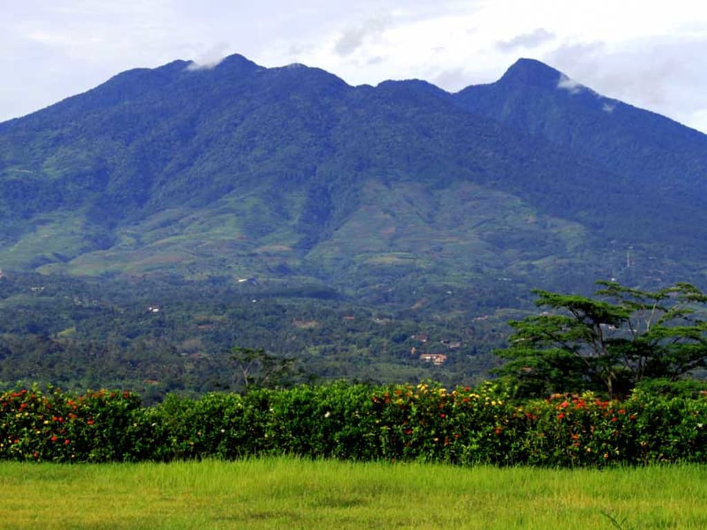 A mysterious view of Mount Salak, containing spirits and dark mysteries at dusk. Perfectly captures the ambiance of the eeriness of the mountain.