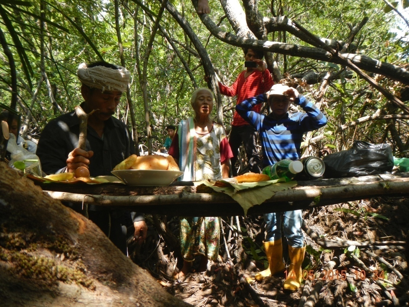 Cultural ritual appealing to forest spirits for protection.