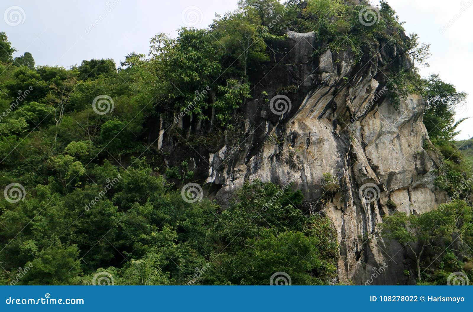 View of the Hanging Stone in Lake Toba, representing significant stones in Sumatran folklore.