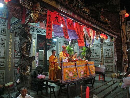 An array of food offerings arranged beautifully for the spirits during the Ghost Month.