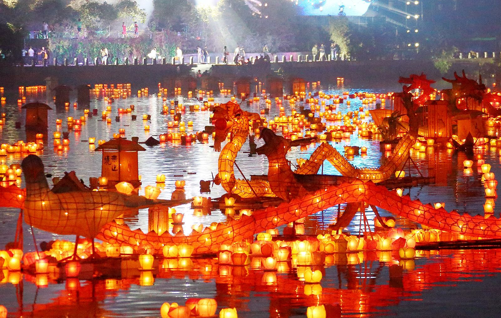 Lanterns floating on the river during the Ghost Festival, a significant ritual for honoring the spirits.