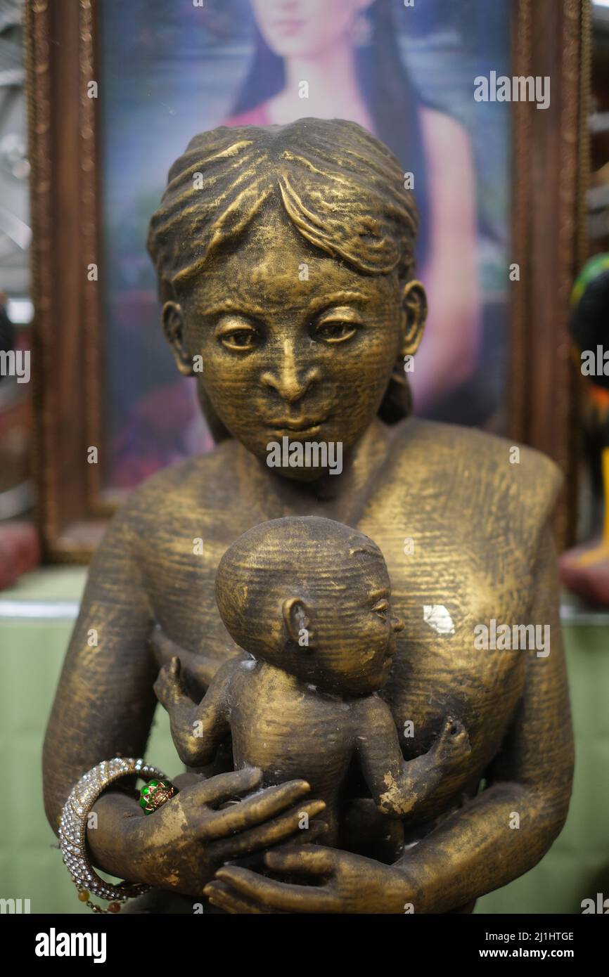 Statue of Mae Nak situated in her shrine, symbolic of her enduring presence in Thai culture.