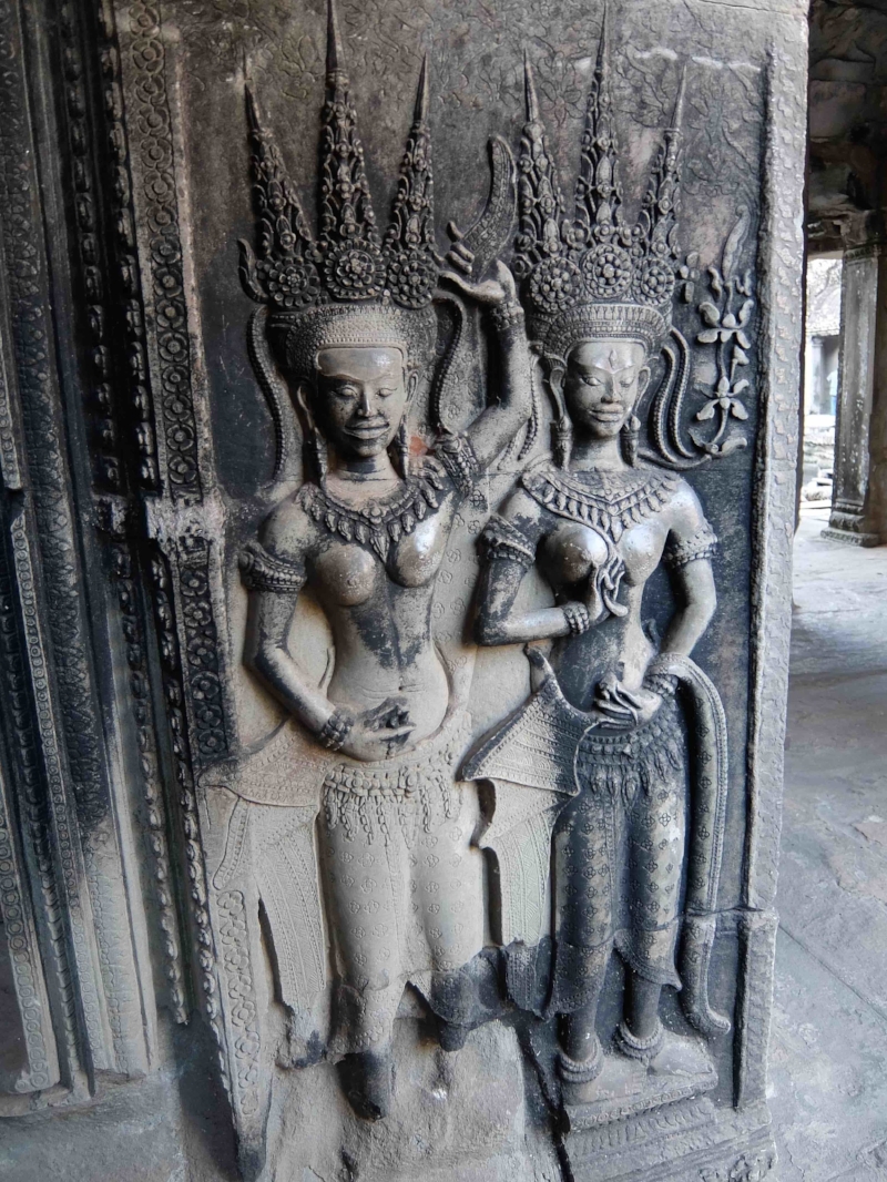 Two Apsara dancers representing Cambodian folklore and spirits.