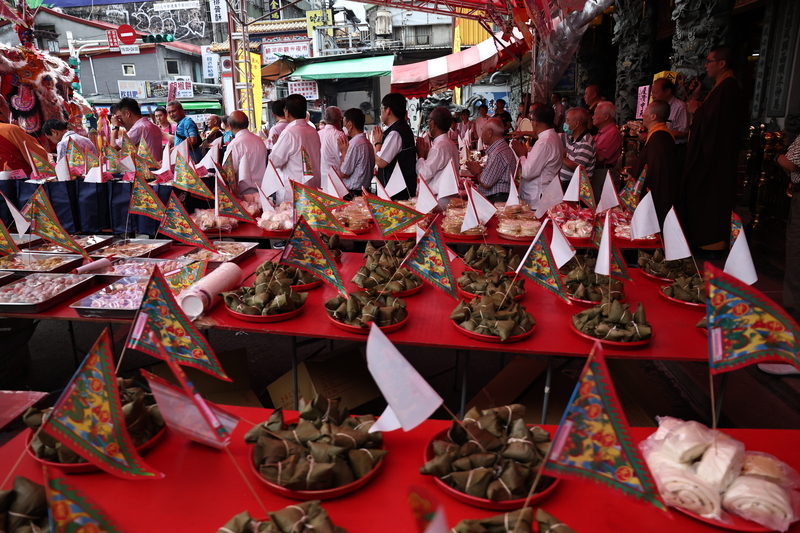 A local shrine with ghost offerings and rituals