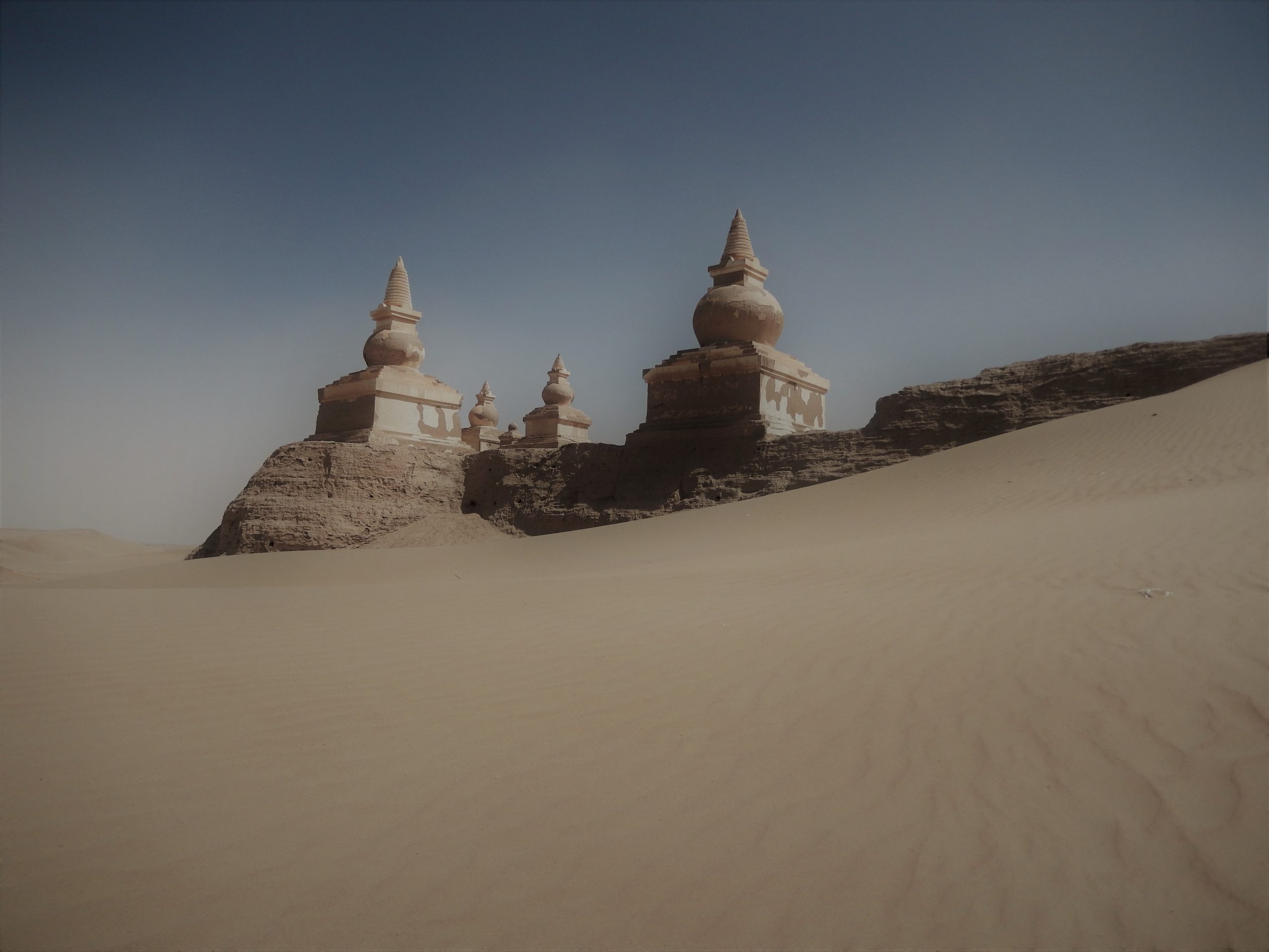 Ghostly view of stupas from Khara Khoto highlighting the ancient city's architecture