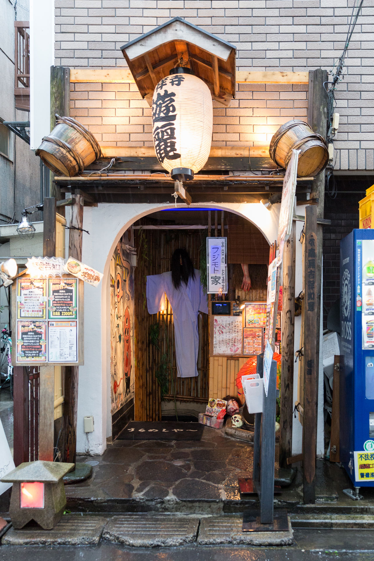 Entrance of Kichijoji Yūrei Izakaya with playful ghost theme.