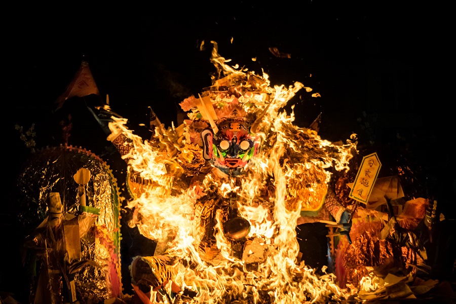 A vibrant and culturally rich scene celebrating Ghost Month with various symbolic set-ups.