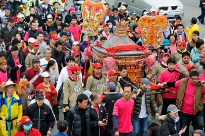 A scenic view of the festival, highlighting the colorful and traditional aspect surrounding the Mazu statue.