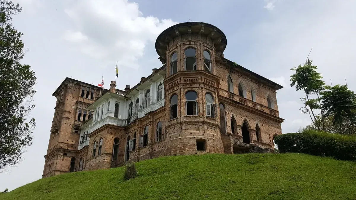 Kellie's Castle at dusk, creating an eerie atmosphere that resonates with the haunting theme in the story.