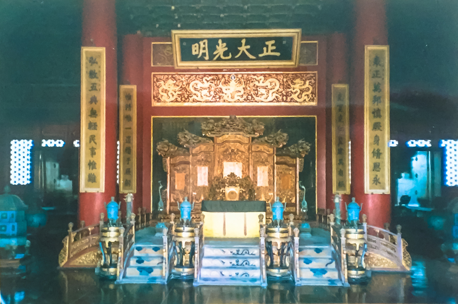 Shadowy figure in traditional robes walking through the Forbidden City at night